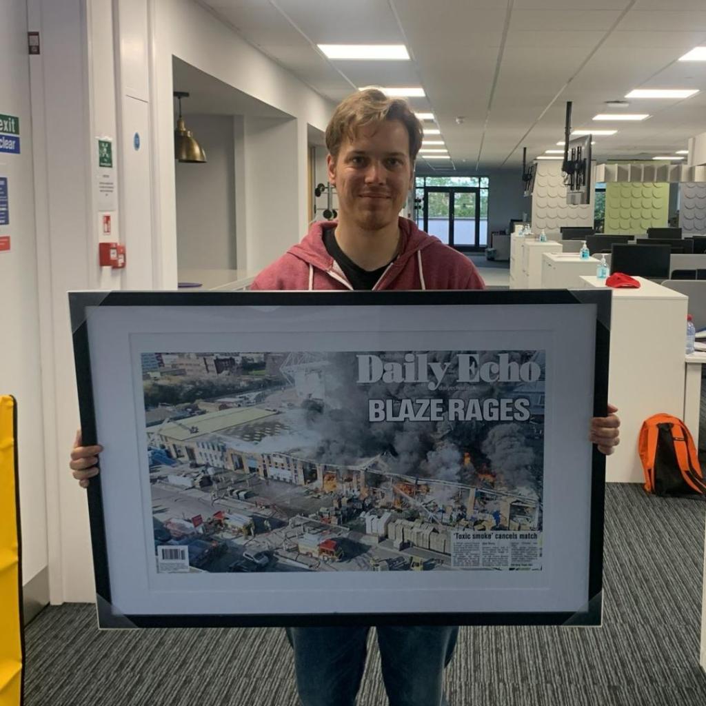 Me in the old Daily Echo office in Southampton holding a framed copy of one of my front pages